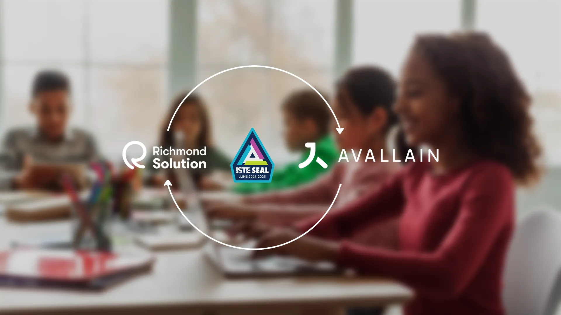A background image of children in a classroom. The logos of Richmond Solutions, Avallain, and the ISTE Seal Award.